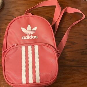 Pink Adidas mini backpack with three stripes